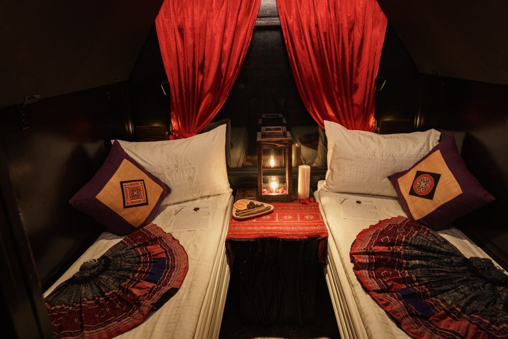 Luxury cruise cabin with cozy beds and elegant decor in Halong Bay.
