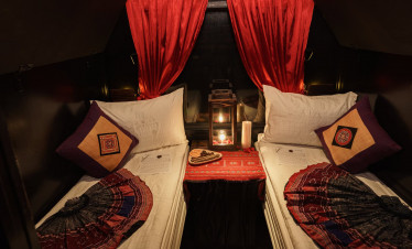 Luxury cruise cabin with cozy beds and elegant decor in Halong Bay.