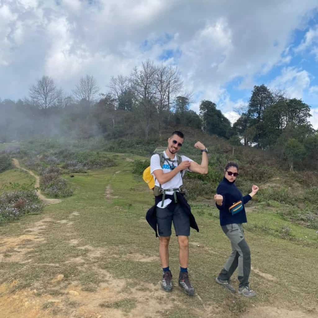 Mount Fansipan trekking adventure with friends in lush scenery.
