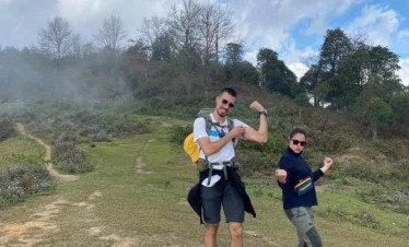 Mount Fansipan trekking adventure with friends in lush scenery.