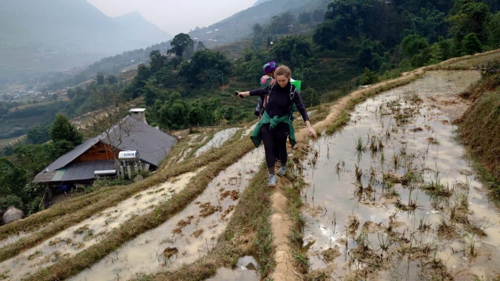 Rice terrace trekking adventure in Sapa, Vietnam, offering breathtaking mountain views and authentic.