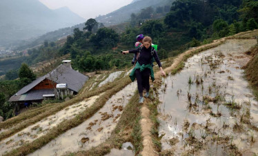 Rice terrace trekking adventure in Sapa, Vietnam, offering breathtaking mountain views and authentic.
