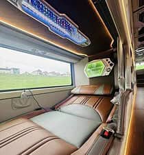 Luxury train cabin with panoramic views of Halong Bay.