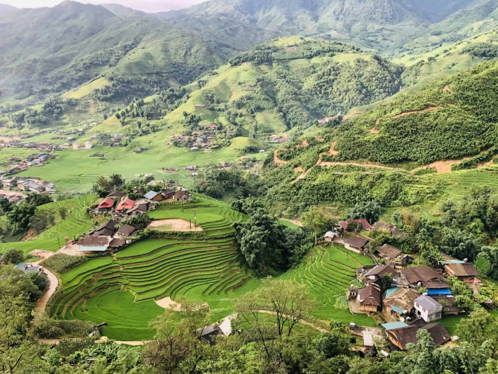 Rice terraces in Sapa showcasing lush green landscapes and traditional village life.