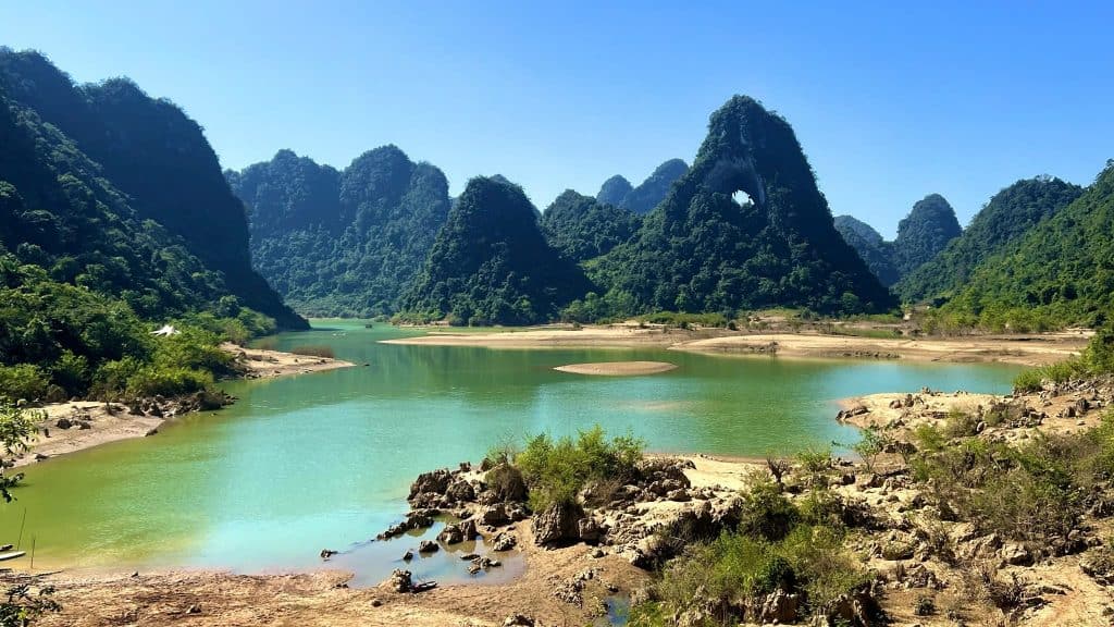 Hanoi Sapa Ha Long Bay scenic view with lush mountains and tranquil waters.