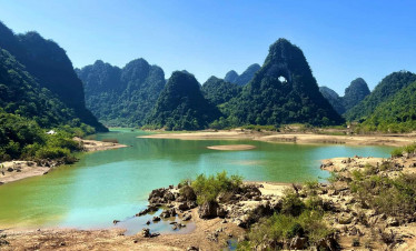 Hanoi Sapa Ha Long Bay scenic view with lush mountains and tranquil waters.
