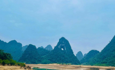 Karst mountains and river scenery in Northern Vietnam, showcasing stunning natural beauty and tranqu.