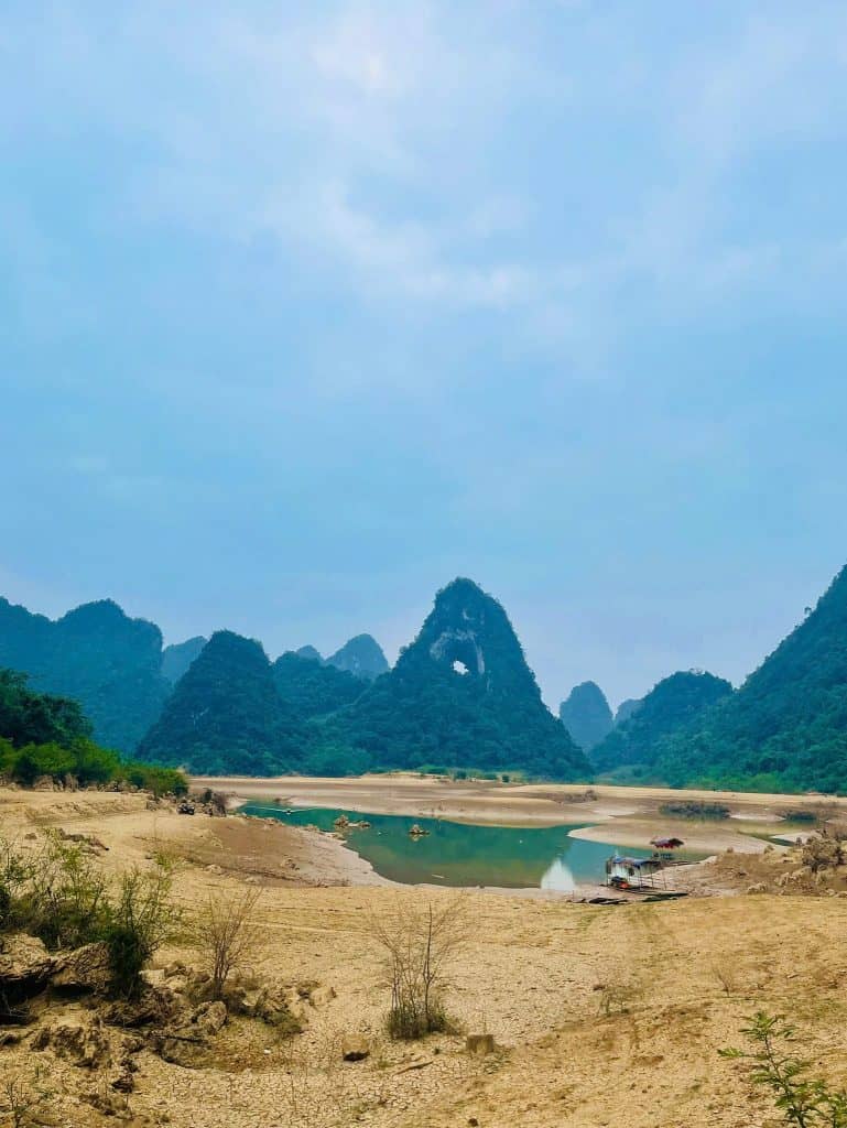 Karst mountains and river scenery in Northern Vietnam, showcasing stunning natural beauty and tranqu.