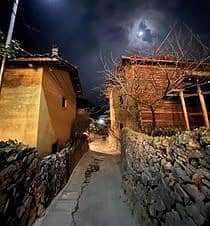 Ha Giang village under moonlight, peaceful and scenic experience.