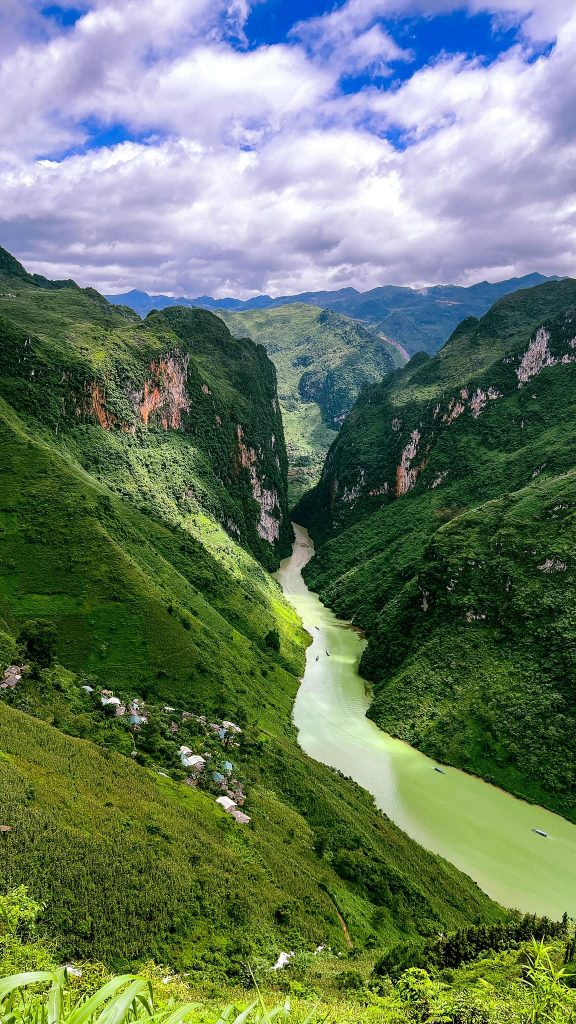 Limestone mountains and river landscape in Vietnam, showcasing stunning natural beauty and lush gree.