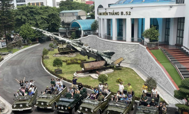 Hanoi jeep tour with vintage vehicles and enthusiastic travelers exploring the city’s historic sites.