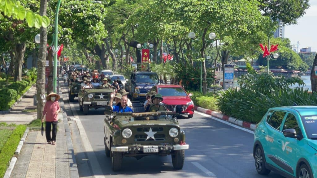 Hanoi jeep tour with vibrant city views and exciting motorbike rides through bustling streets.