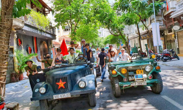 Hanoi city tour with vintage jeeps and motorbikes, exploring vibrant streets and local culture.