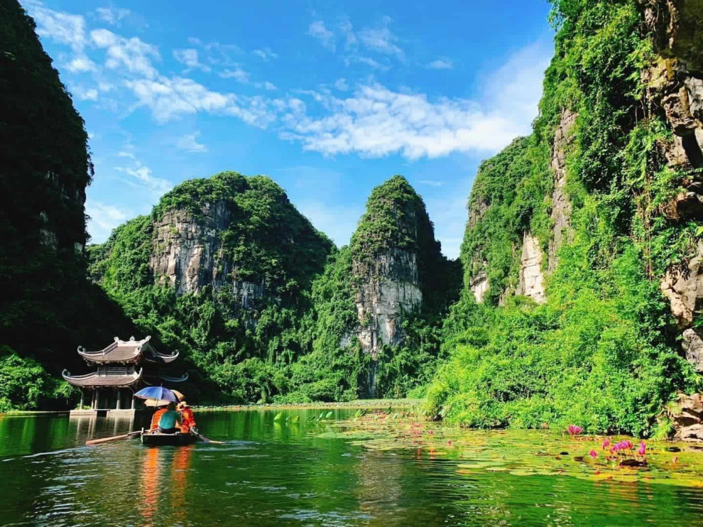 Ha Long Bay scenic landscape with towering limestone karsts and emerald waters.