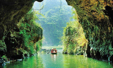Ha Long Bay scenic boat ride through limestone caves.