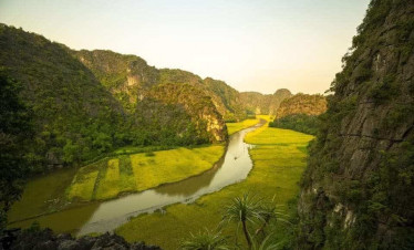 Halong Bay scenic view with lush green islands and calm waters.