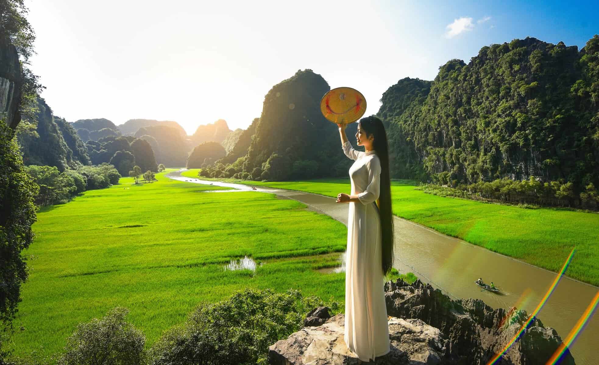 Vietnam Tours - Ninh Binh scenic view with lush green landscape and limestone karsts.