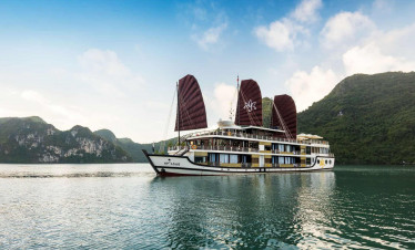 Luxury cruise sailing through Halong Bay's stunning limestone karsts.