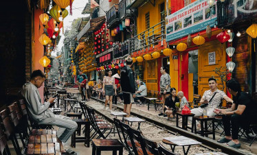 Vietnam street food market with vibrant lanterns and lively atmosphere.