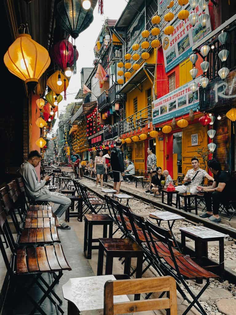 Vietnam street food market with vibrant lanterns and lively atmosphere.