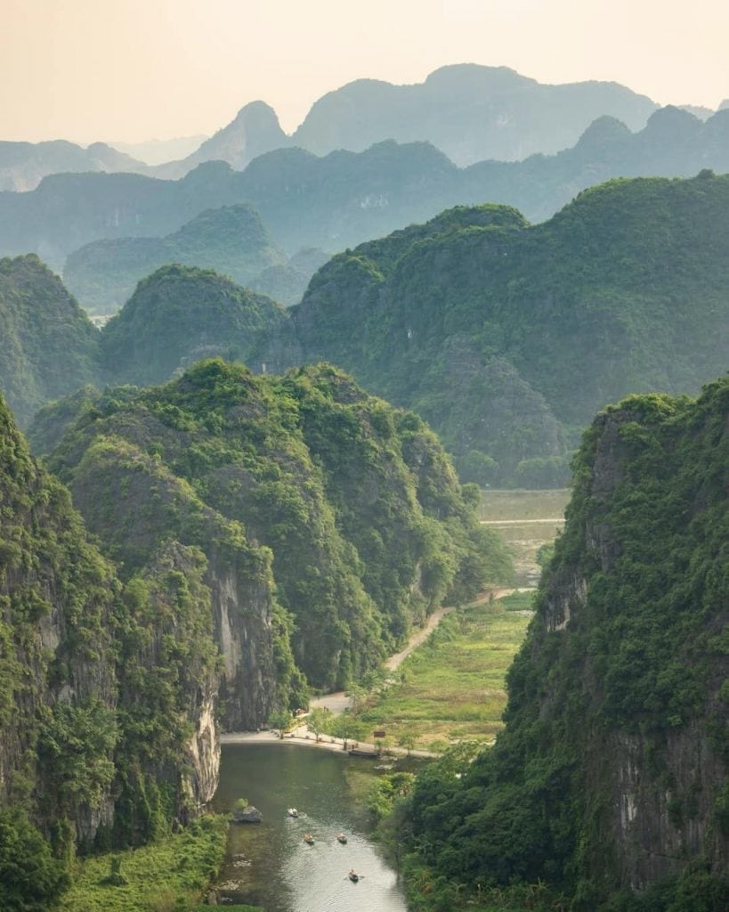 Halong Bay scenic view with lush green islands and calm waters.