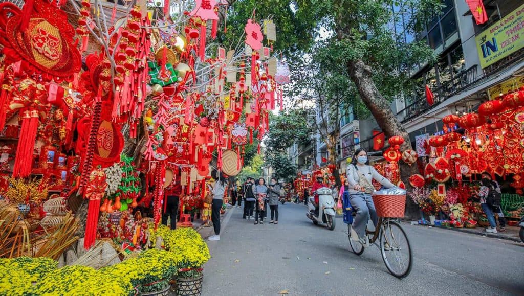 Lunar New Year celebration with vibrant decorations and festive atmosphere in Hanoi.