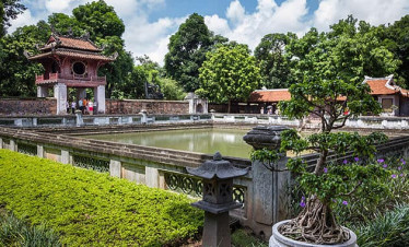Vietnam Heritage Garden - Tranquil pond and traditional architecture.