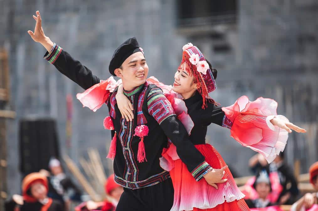 Cultural dance performance in Sapa showcasing traditional costumes and vibrant local culture.