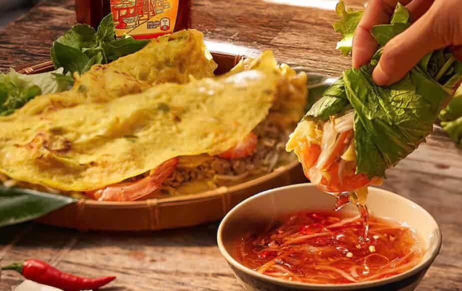Vietnamese spring roll with dipping sauce, fresh herbs, and vibrant flavors.