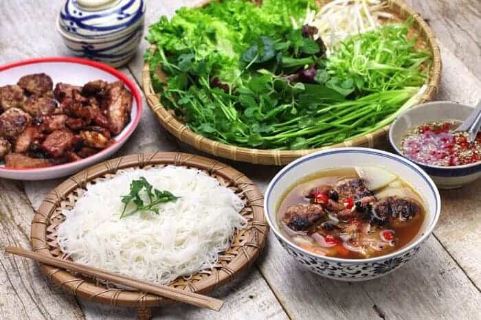 Vietnamese Food Platter with Fresh Herbs and Soup.