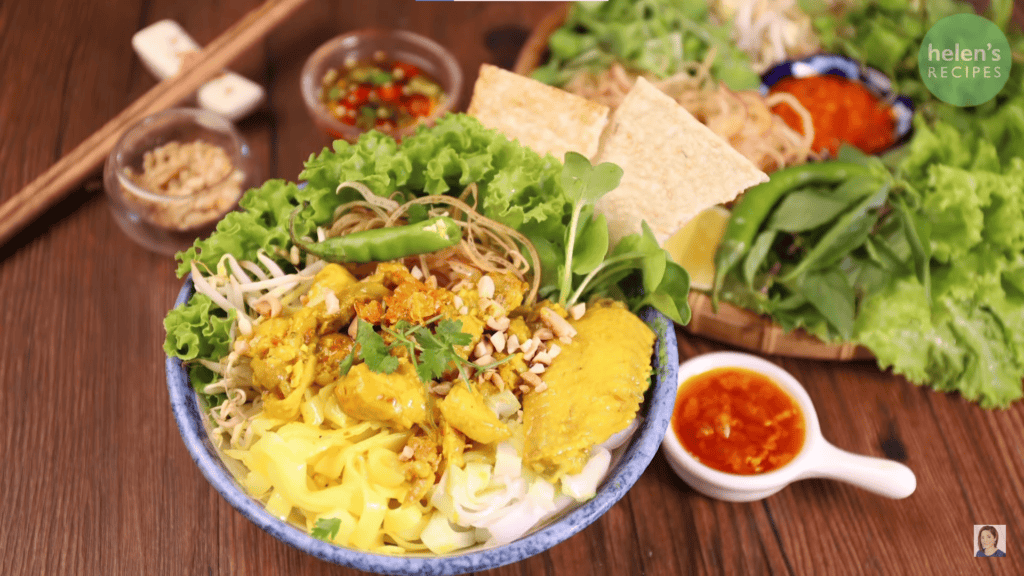 Vietnam food platter with fresh herbs and traditional dishes.