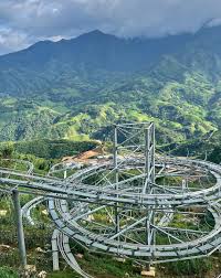 Stunning view of Sapa's lush mountains and winding roads, perfect for nature lovers and adventure se.