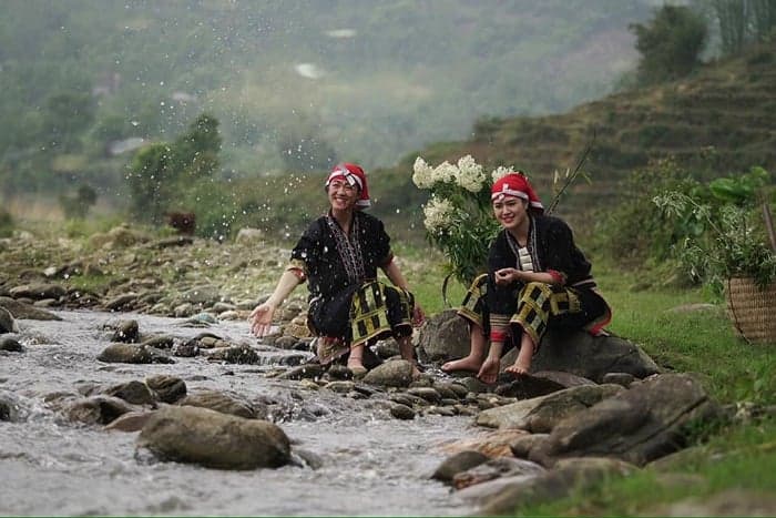 Traditional H'mong Women Washing in River, Sapa Vietnam.