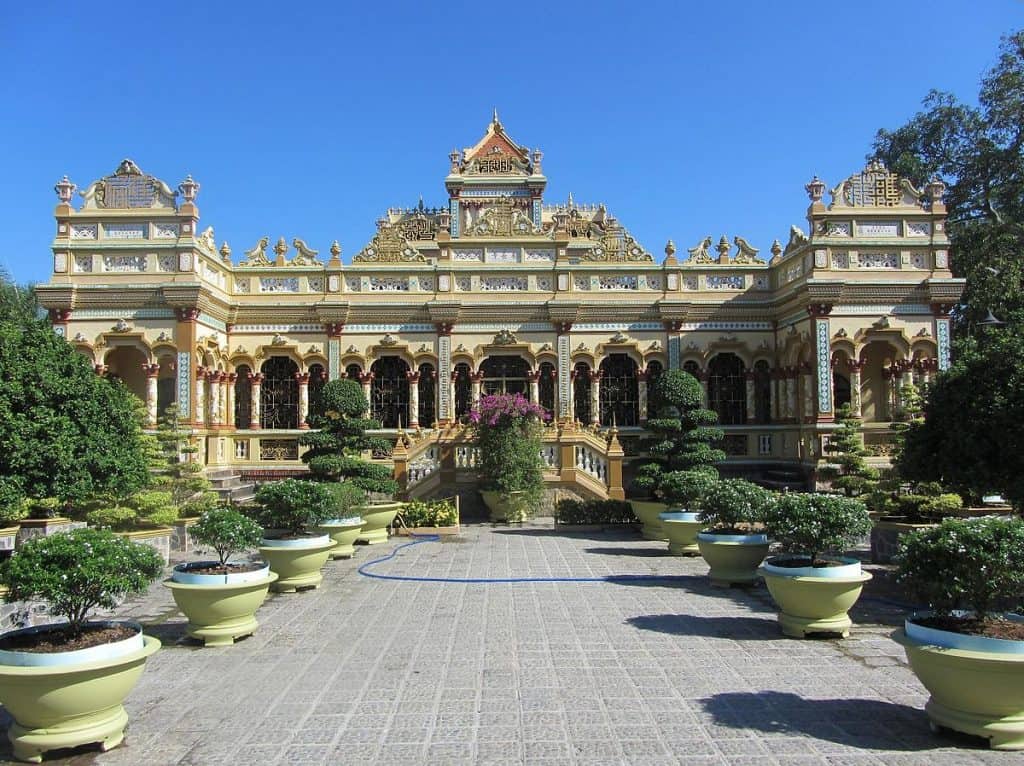 Vietnam Palace exterior - grand historic architecture with lush garden surroundings.