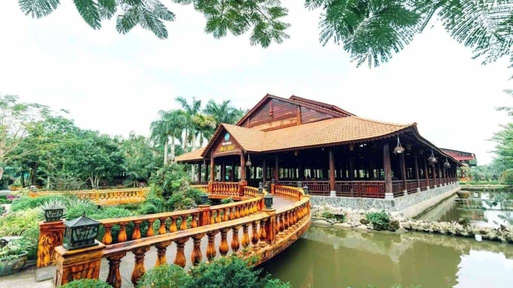 Mekong River Riverside Villa with lush greenery and traditional architecture, perfect for a peaceful.