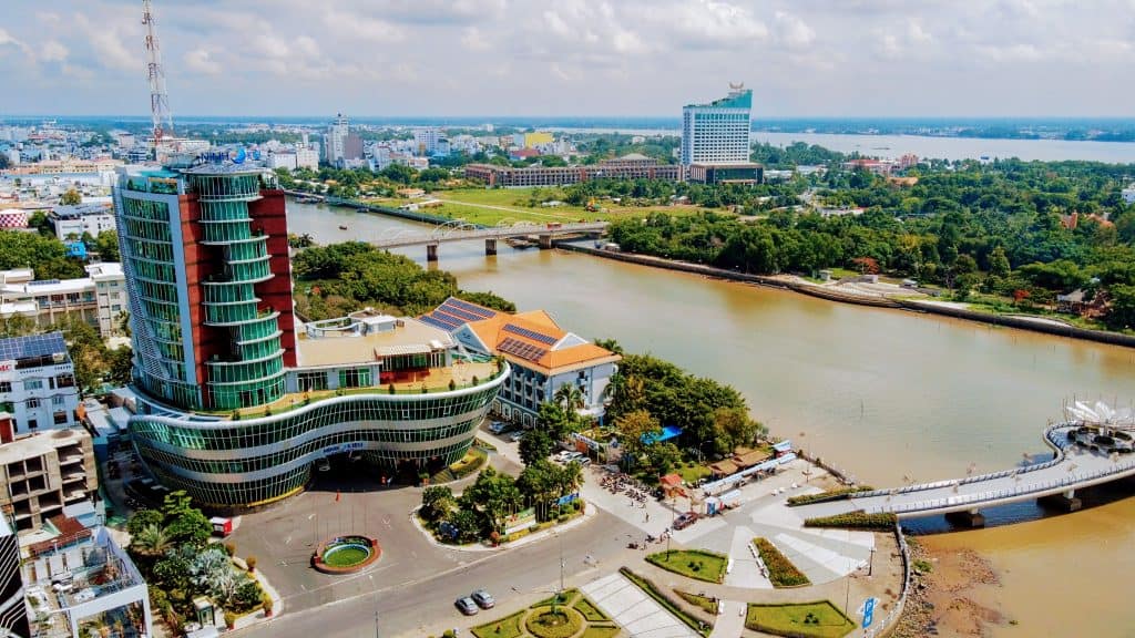 Mekong River and cityscape view from above, showcasing vibrant life along Vietnam’s delta.
