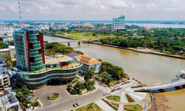 Mekong River and cityscape view from above, showcasing vibrant life along Vietnam’s delta.