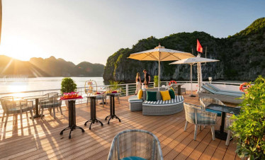 Lan Ha Bay luxury cruise deck with seating and scenic views.