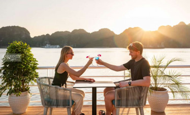 Sunset dinner experience on Serenity Cruise in Lan Ha Bay, offering a romantic and luxurious escape.