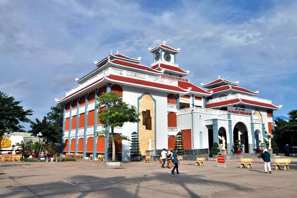 Historic temple in Mekong Delta with traditional architecture and vibrant surroundings.