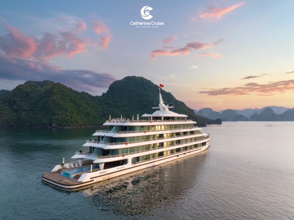 Luxury cruise ship sailing in Ha Long Bay at sunset, scenic limestone islands, Vietnam tourism.