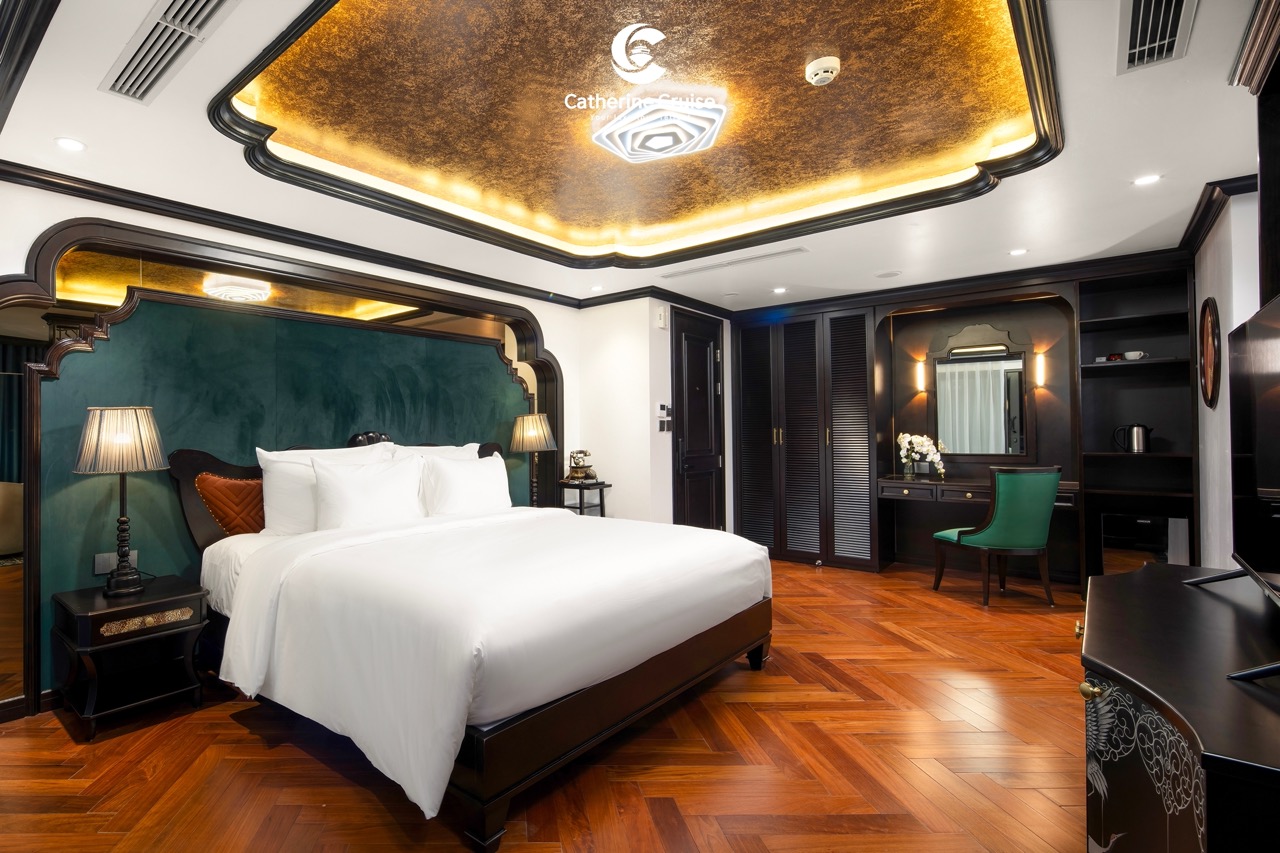 Luxurious hotel bedroom with elegant decor, modern furnishings, and warm lighting for a premium stay.