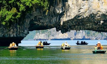 Scenic kayaking adventure in Halong Bay with stunning limestone formations and tranquil waters.