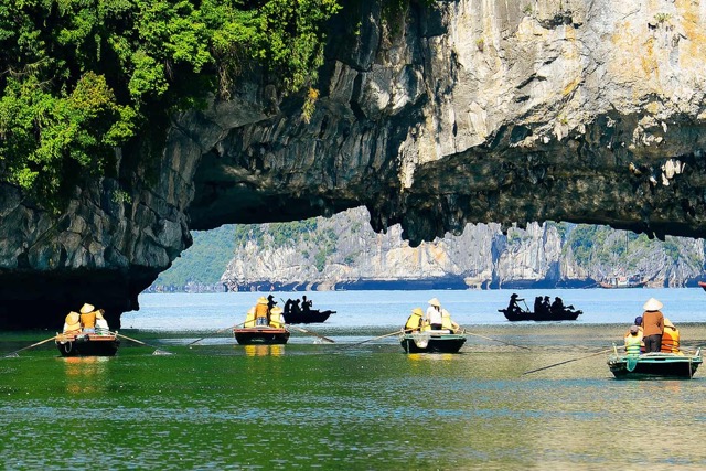 Scenic kayaking adventure in Halong Bay with stunning limestone formations and tranquil waters.