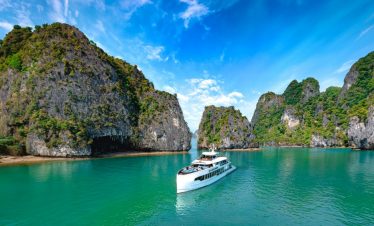 Scenic Halong Bay cruise with limestone islands and turquoise waters, perfect for sightseeing and re.