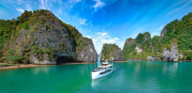 Scenic Halong Bay cruise with limestone islands and turquoise waters, perfect for sightseeing and re.