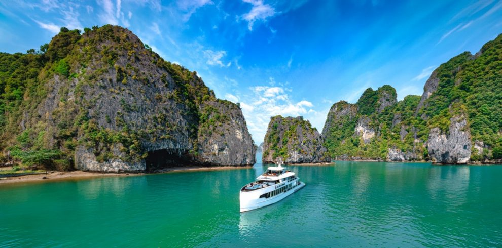 Scenic Halong Bay cruise with limestone islands and turquoise waters, perfect for sightseeing and re.