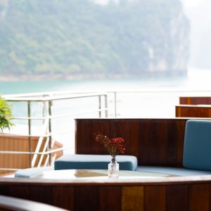 A romantic dinner, warm service, and the glow of the bay at night.