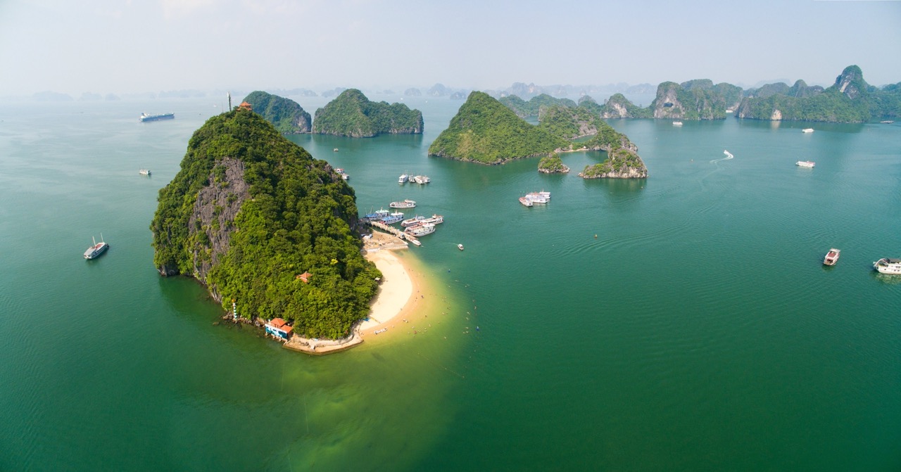 Aerial view of Halong Bay with lush islands and turquoise waters, perfect for a scenic cruise experi.