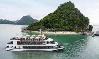 Stunning Halong Bay cruise scene showcasing emerald waters and lush green islands, perfect for luxur.
